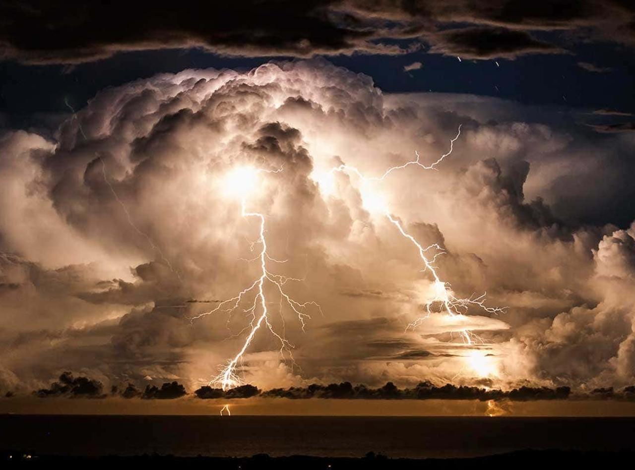 Dramatic lightning storm over dark skies
